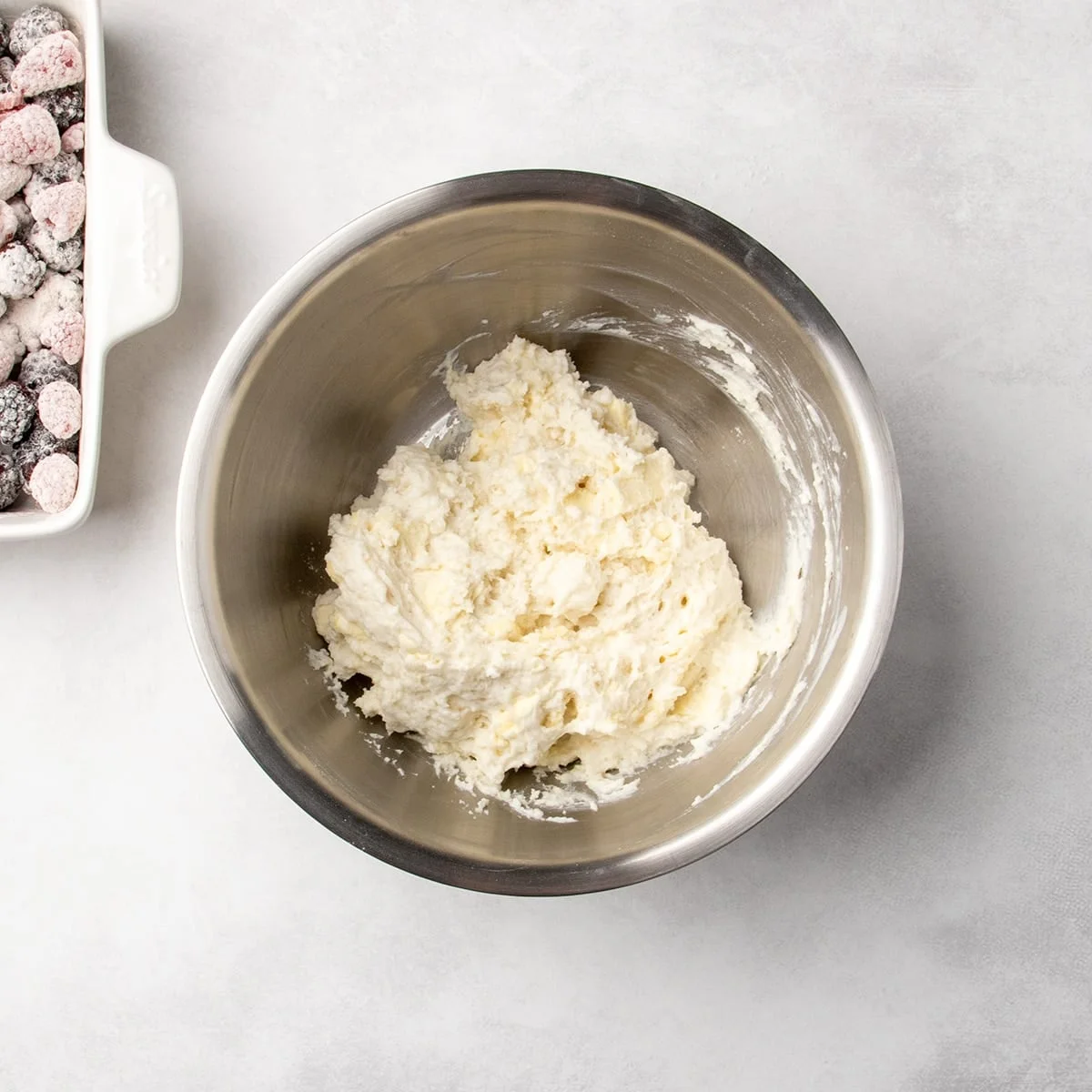 thick pale wet dough mixture in a metal bowl