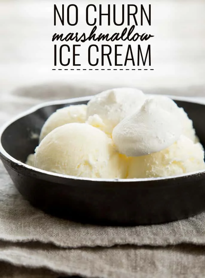4 scoops of ice cream and 2 marshmallows on black skillet