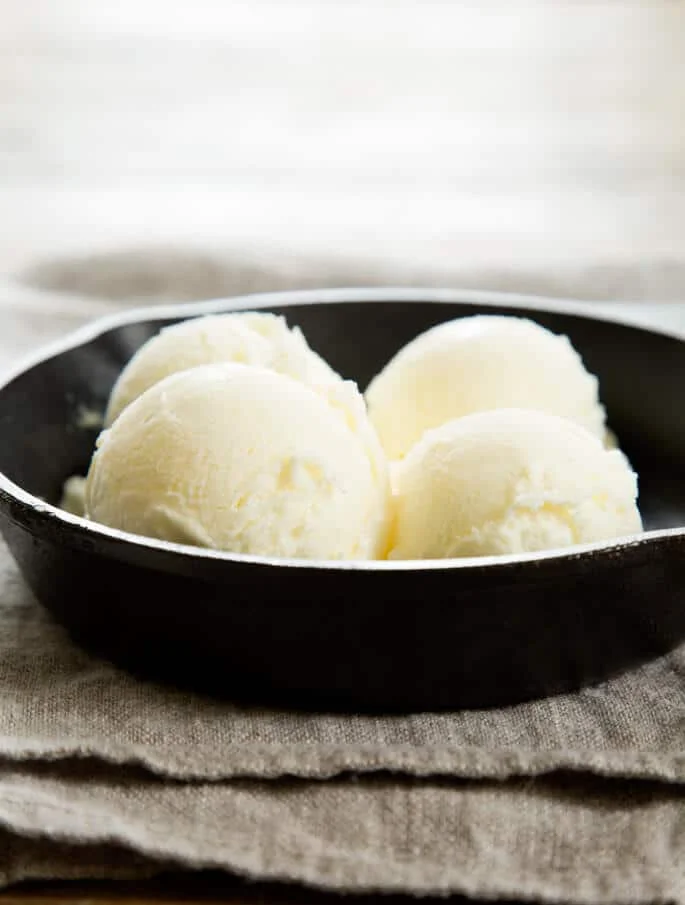 4 scoops of ice cream on black skillet