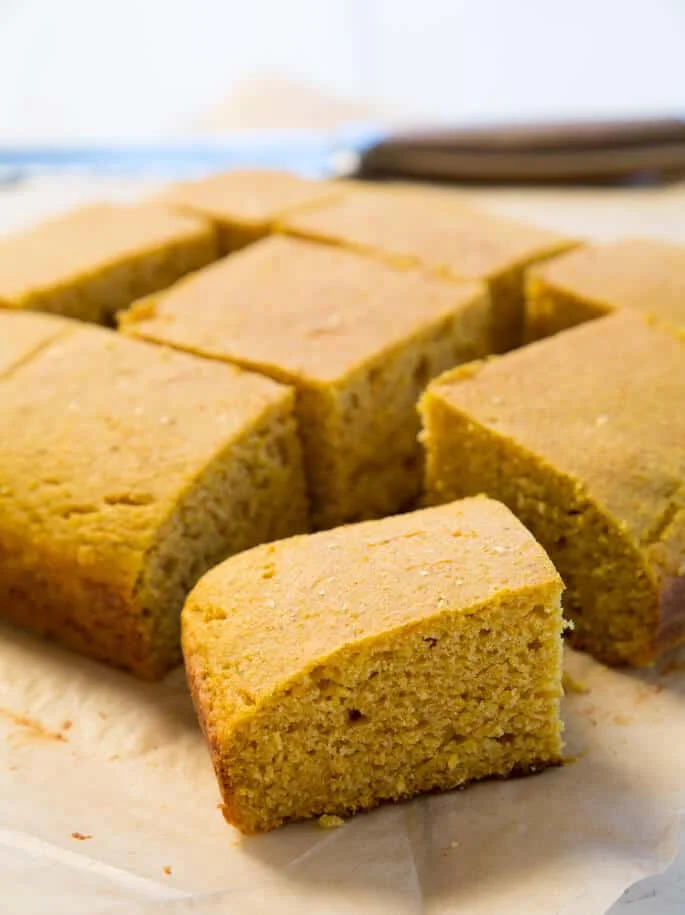 8 pieces of cornbread on beige paper