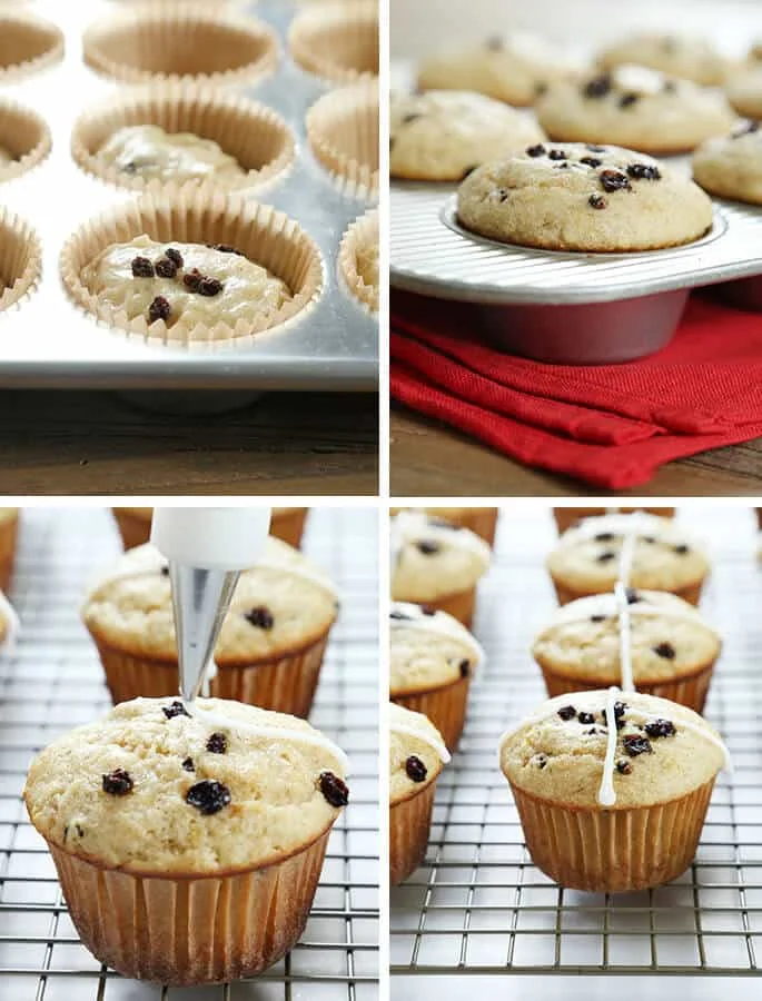 A close up hot cross buns in muffin tray and on metal tin with frosting being out on top