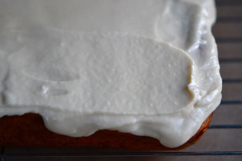 A close up of a frosted krimpet