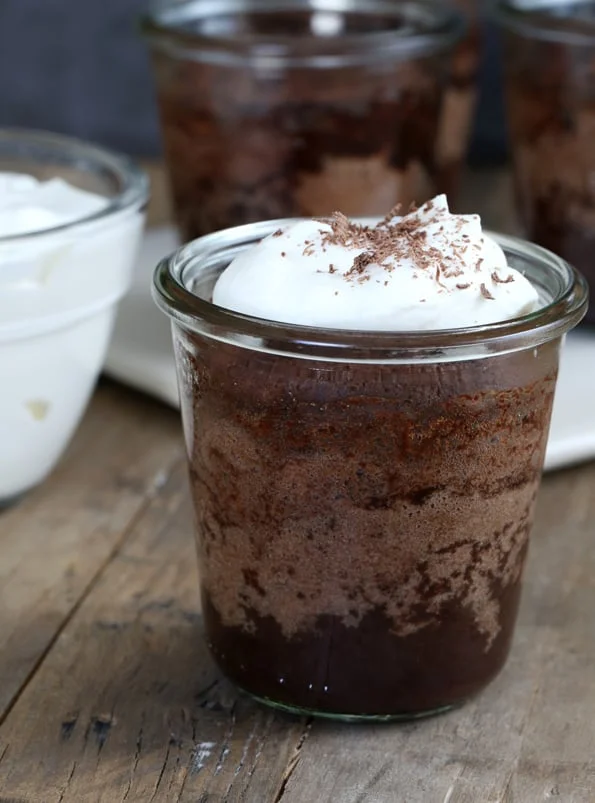 A close up of chocolate pudding cake in a jar
