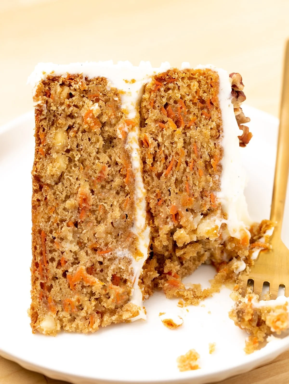A close up view of one slice of the completed cake with one forkful taken out of it. 