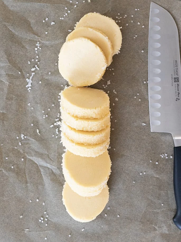 A log of gluten free sable cookie dough, sliced.