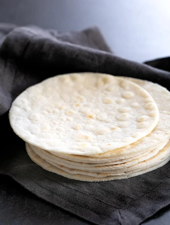 A neat stack of Paleo tortillas in cloth