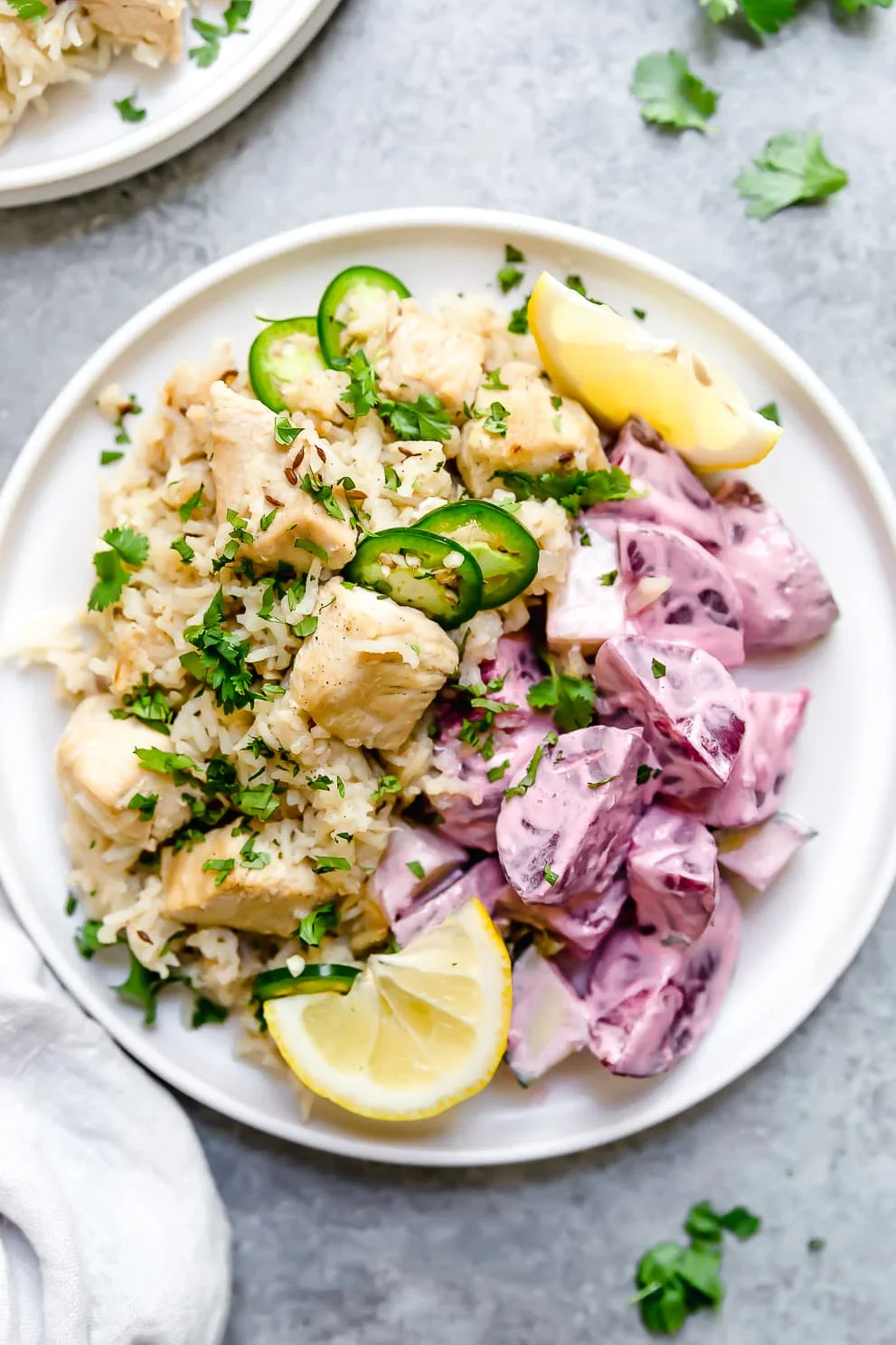 A plate of Indian pulao with lemon wedges