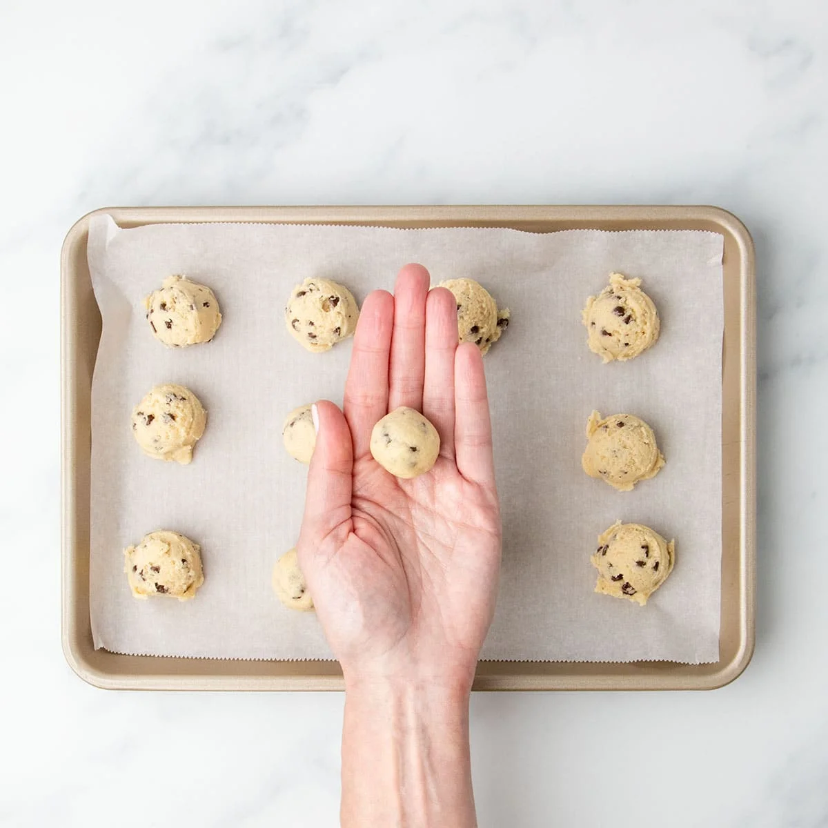 A single portion of shaped round of cookie dough.