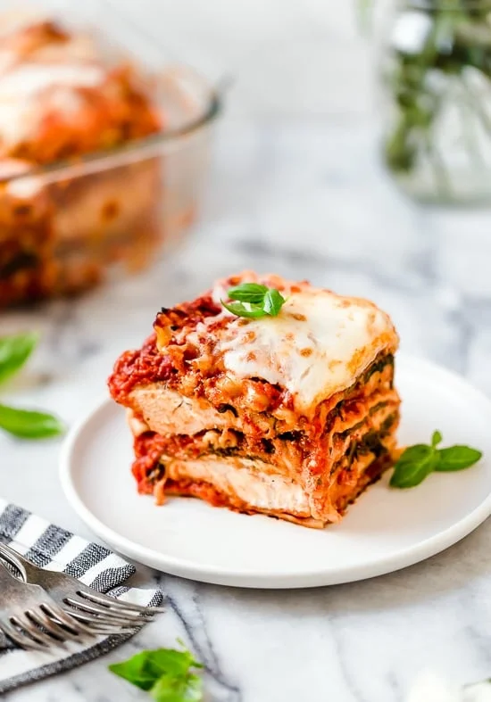 A slice of chicken parmesan lasagna on a plate
