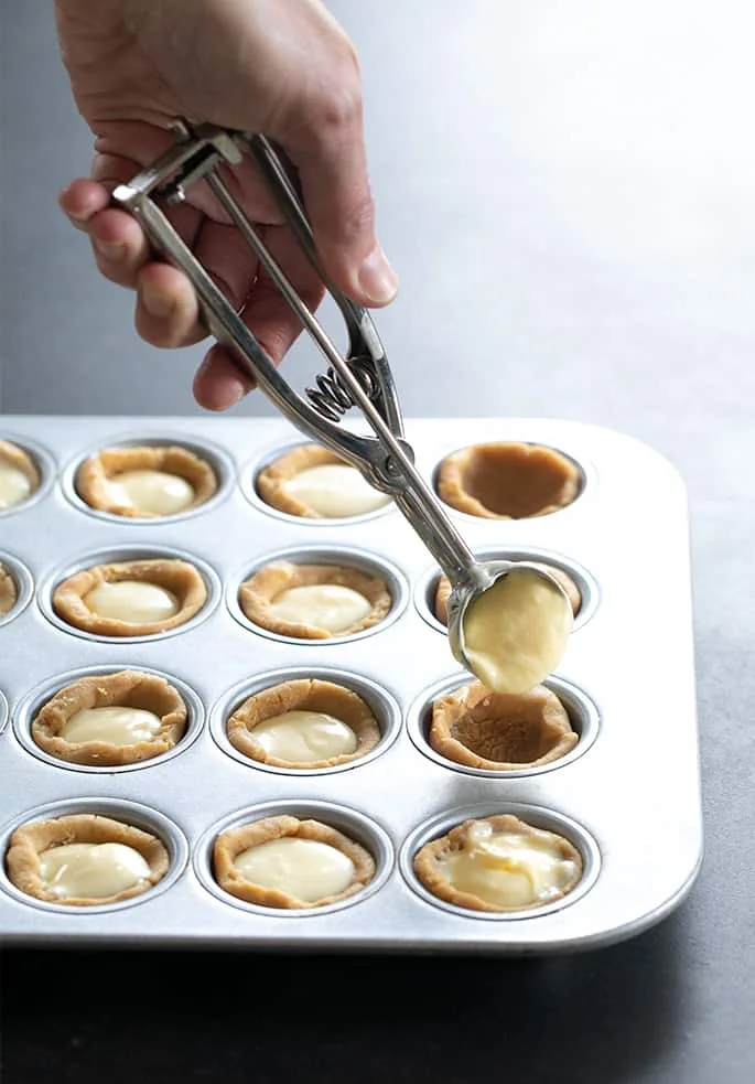 A soft graham cracker crust with the simplest cheesecake filling makes these cheesecake cookie cups the perfect cookie plate surprise.