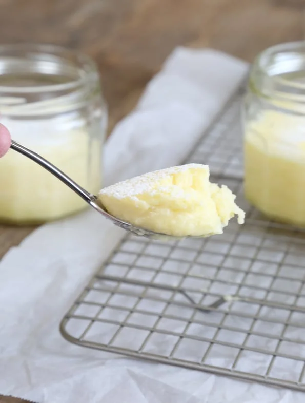 A spoon with yellow cake on it