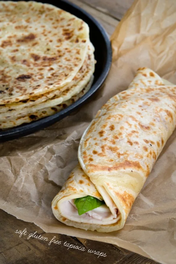 A stack of soft tapioca wraps and one made into a sandwich
