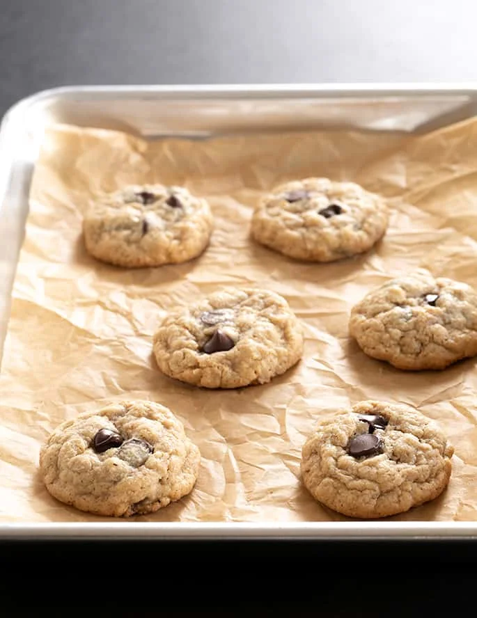 A tray of baked peanut butter oatmeal chocolate chip cookies
