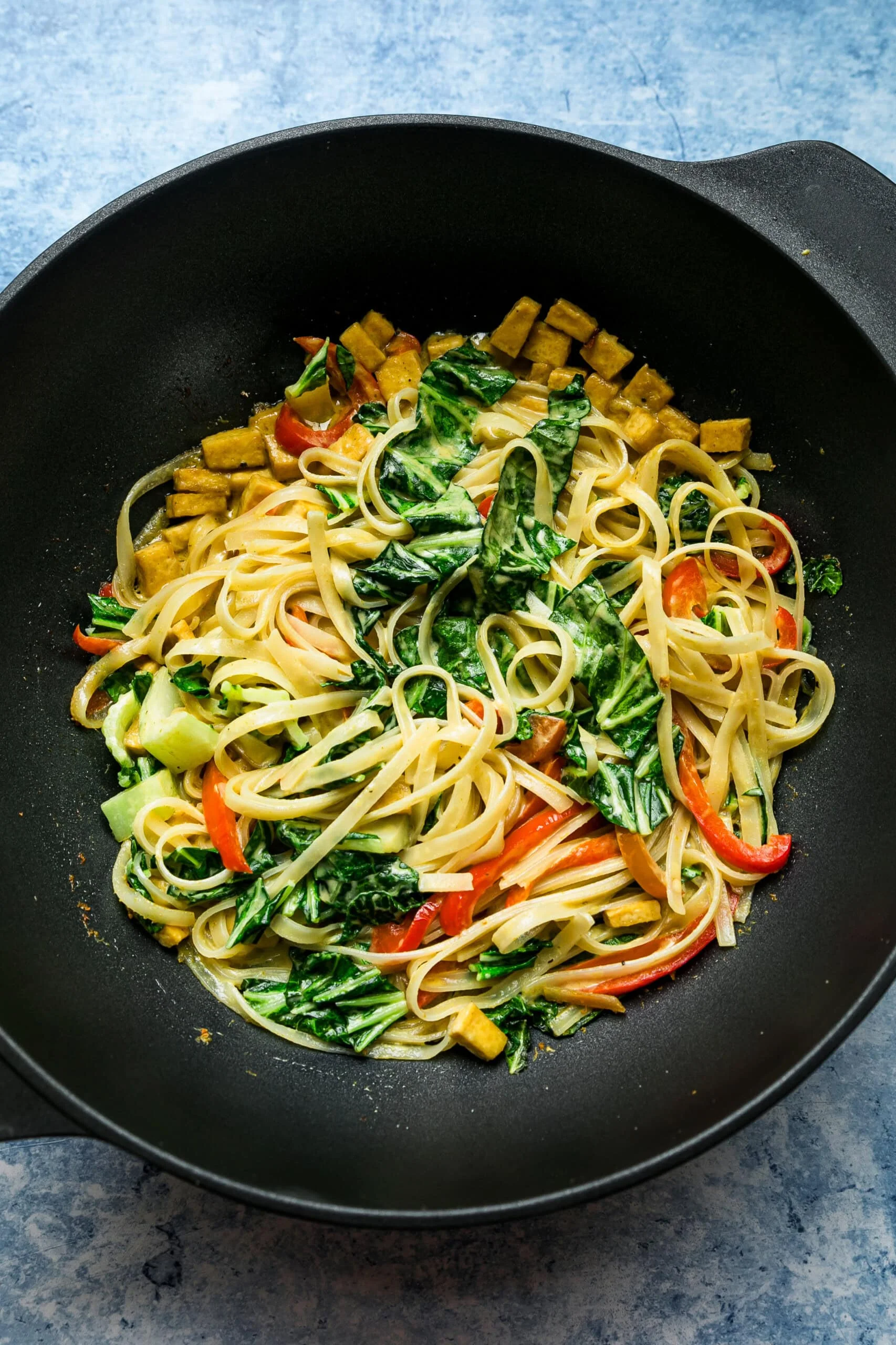 add bok choy and noodles to wok