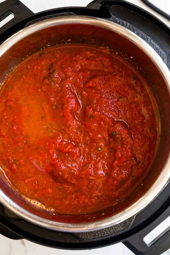 Add the water, pasta and marinara sauce
