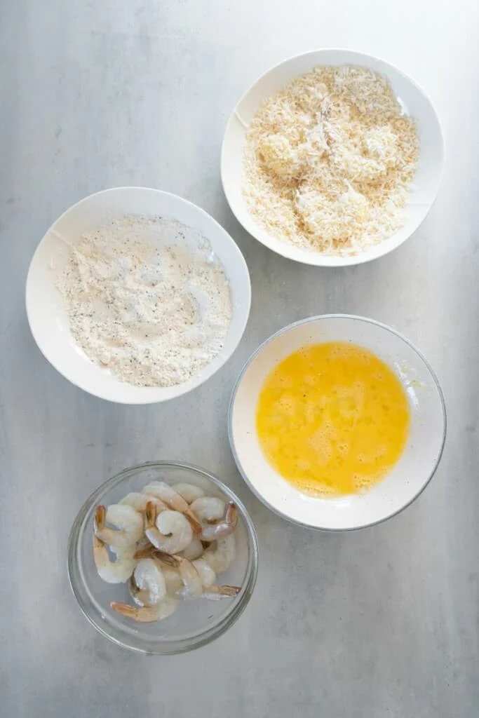 adding breading to shrimp
