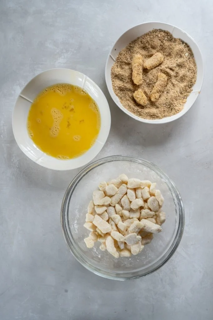adding coating to cheese curds