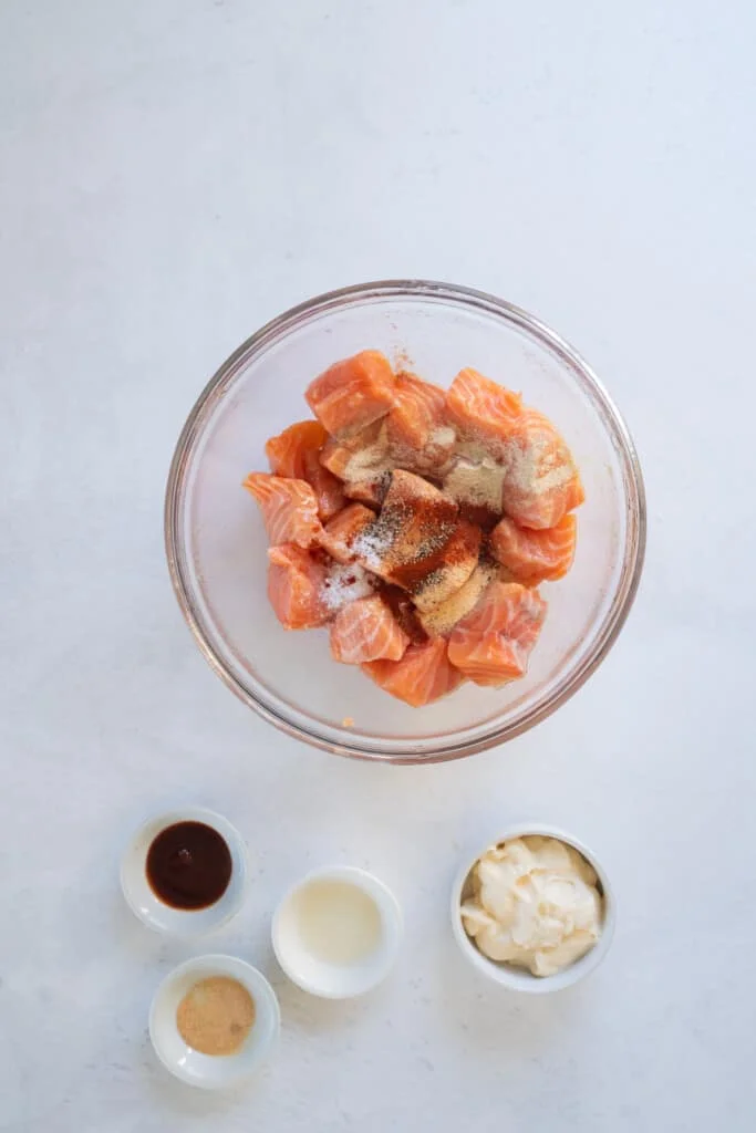 adding spices to salmon