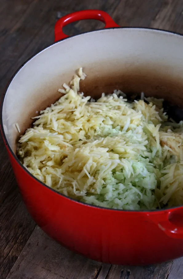 Apple shreds in a red pot