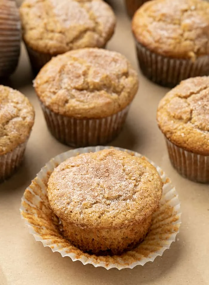 Applesauce muffin with white liner peeled back