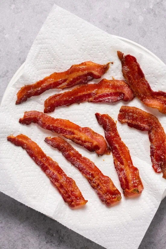 bacon on a paper towel-lined plate