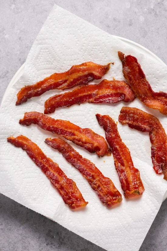 bacon on a paper towel-lined plate
