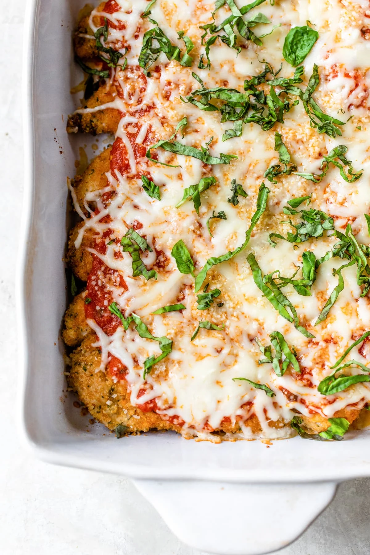 Baked Chicken tenderloin Parmesan in a baking dish