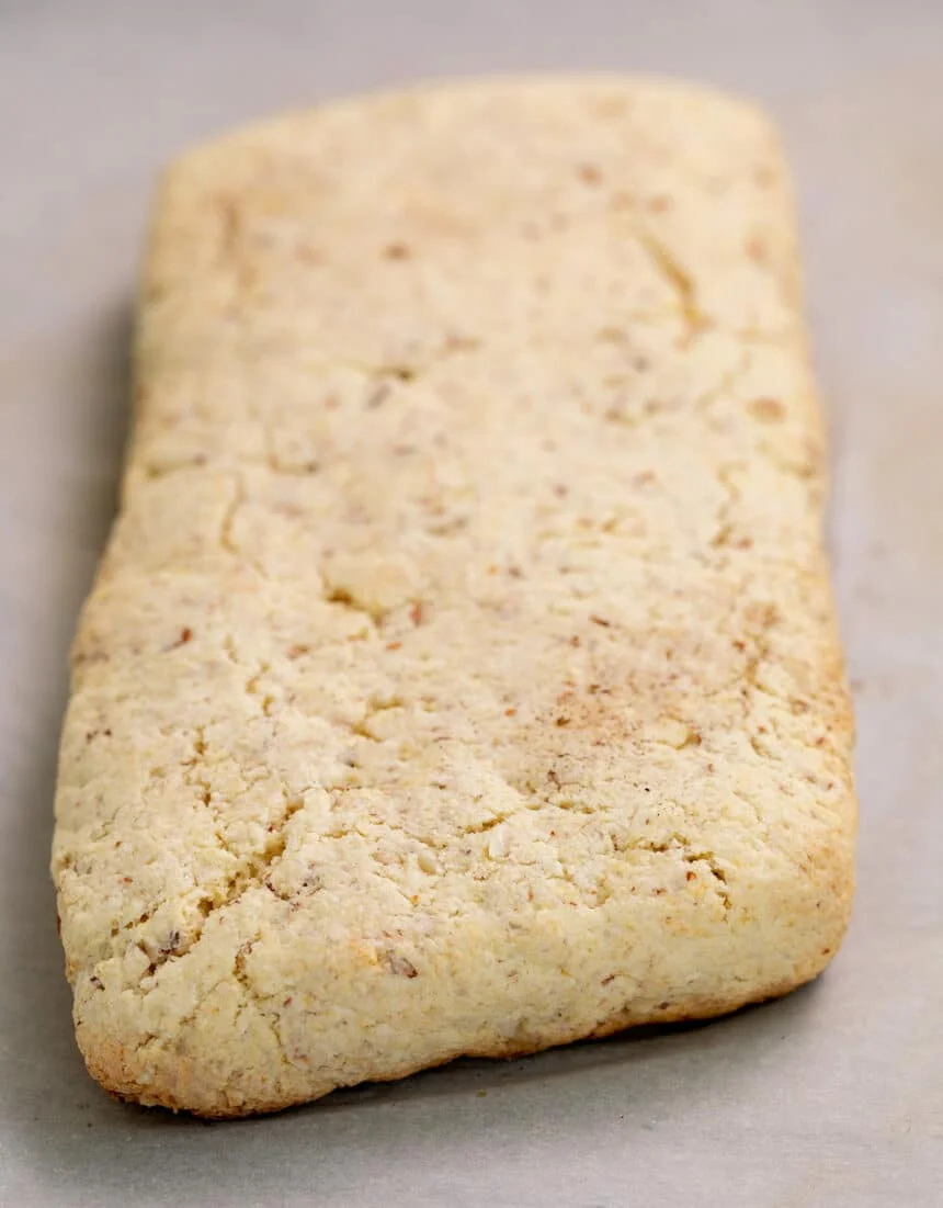 Baked uncut biscotti on white paper