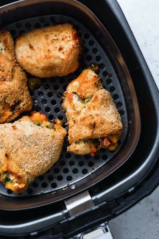 Broccoli and Cheese Stuffed Chicken is filled with cheddar and broccoli, then rolled up, breaded and baked in the oven or air fryer!