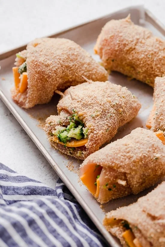 Broccoli and Cheese Stuffed Chicken is filled with cheddar and broccoli, then rolled up, breaded and baked in the oven or air fryer!