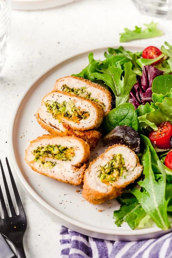 Broccoli and Cheese Stuffed Chicken is filled with cheddar and broccoli, then rolled up, breaded and baked in the oven or air fryer!