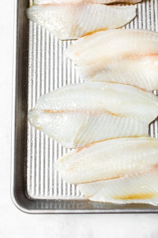 Broiled Tilapia with Thai Coconut Curry Sauce has so much flavor, perfect over jasmine rice to absorb all the delicious sauce.