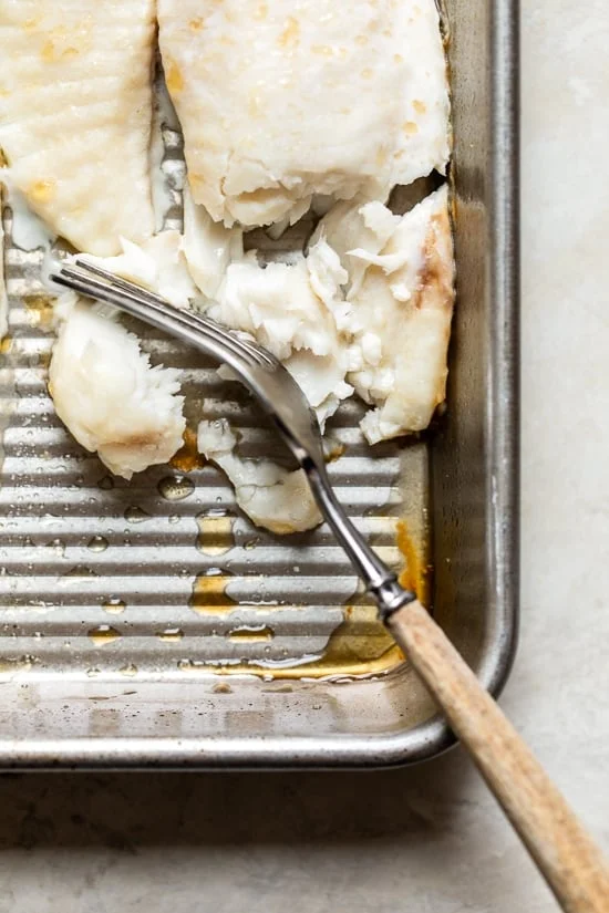 Broiled Tilapia with Thai Coconut Curry Sauce has so much flavor, perfect over jasmine rice to absorb all the delicious sauce.
