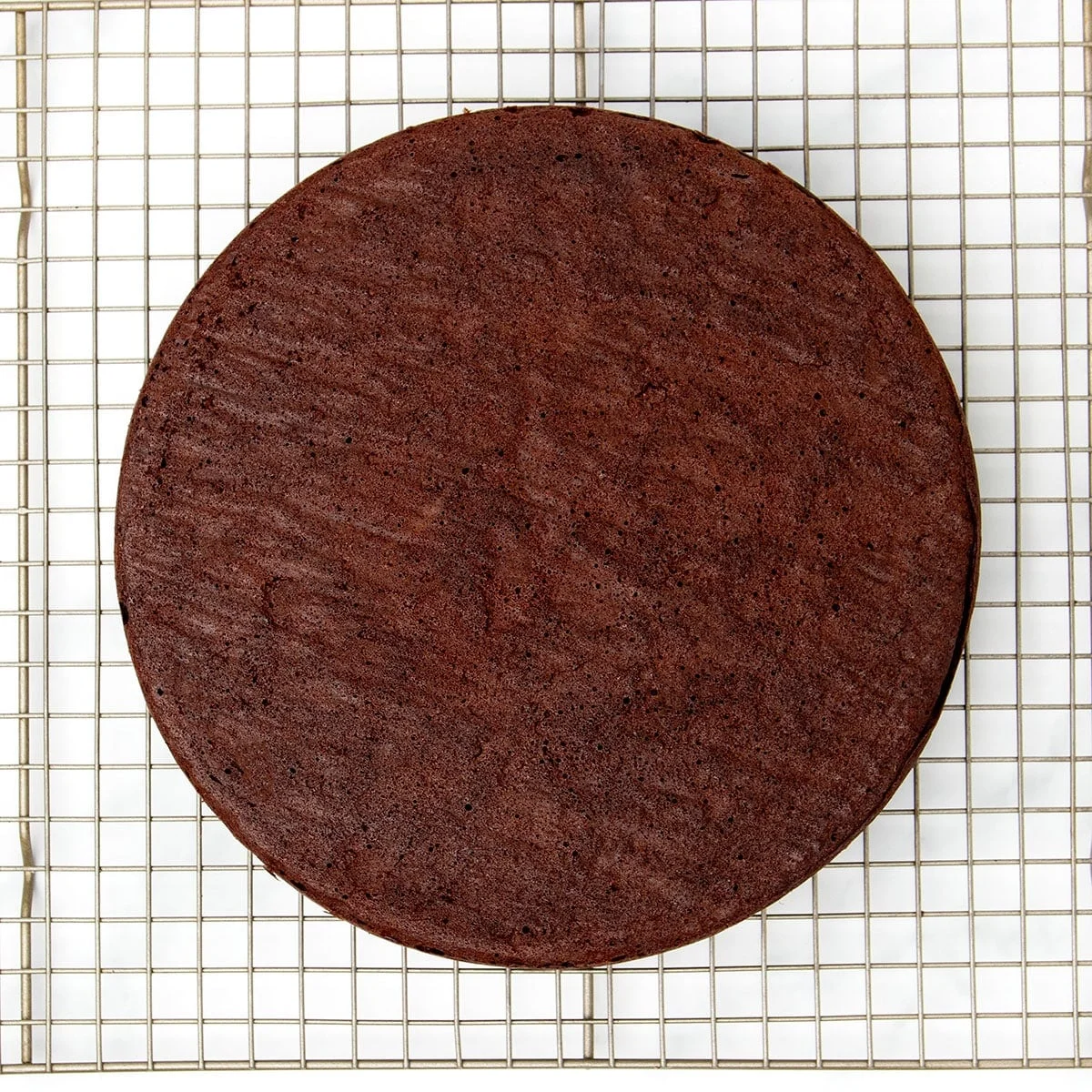 brown cake out of pan on wire rack