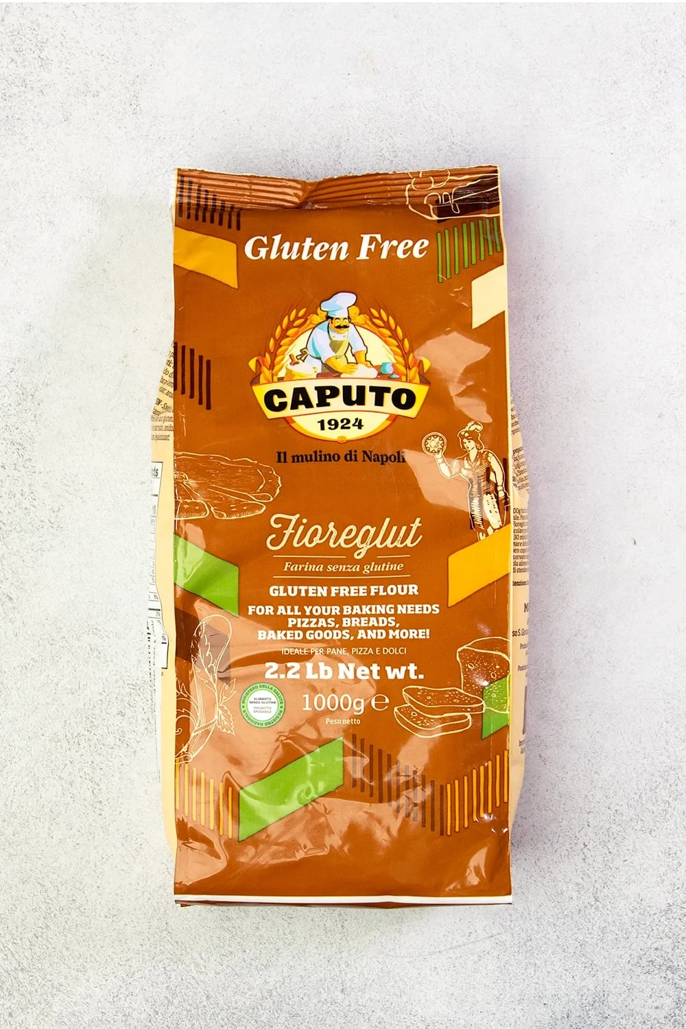 Brown, yellow and black bag of Caputo Fioreglut gluten free flour on white background