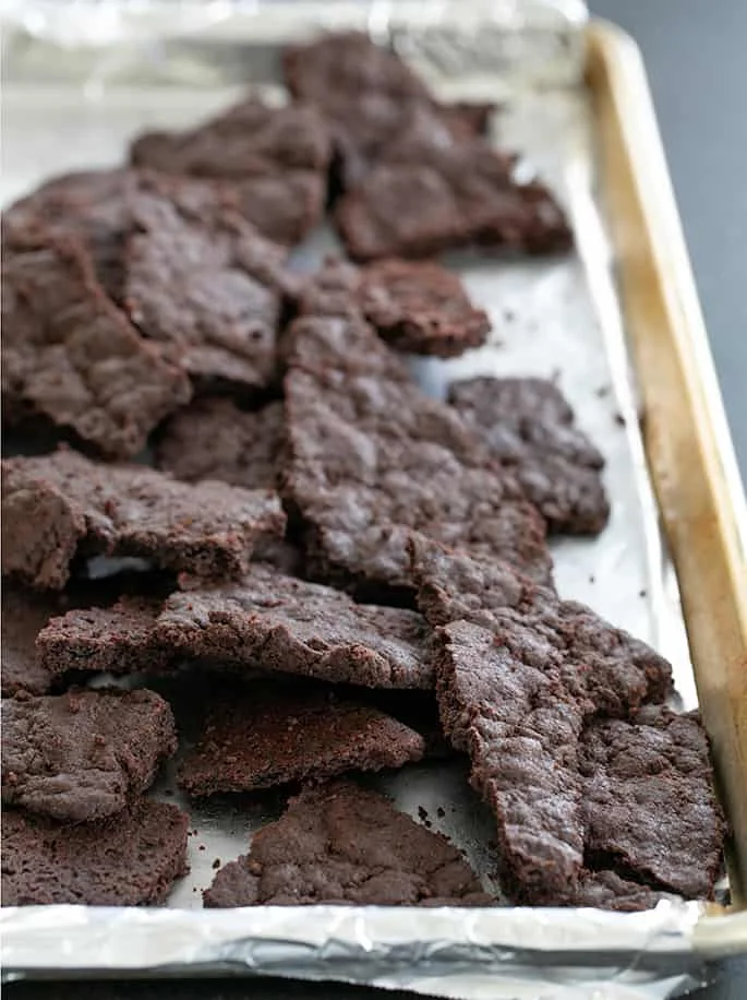 Brownie crisp baked on tray and broken into pieces