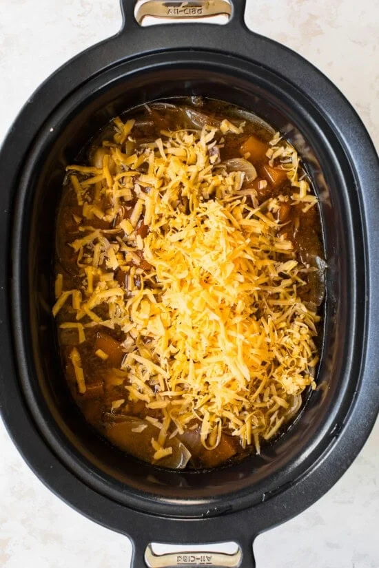 Butternut Squash Cheddar Beer Soup in the slow cooker with cheddar