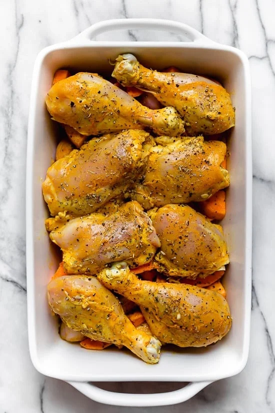 Caramelized sweet potatoes and shallots are the bed for roasted chicken thighs and legs that come together in this one-pot healthy chicken dinner.
