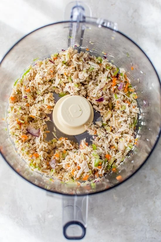 chicken and chopped veggies in food processor