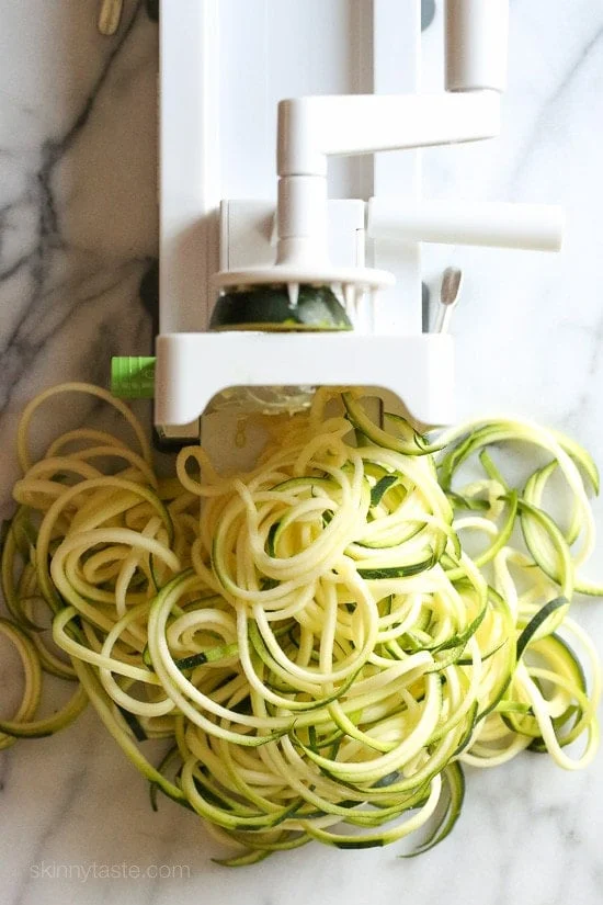 Chicken and Zucchini Noodle Caprese is made with sauteed bite-sized chicken breast and grape tomatoes cooked with spiralized zucchini, fresh mozzarella and basil. An easy, low-carb 30-minute meal!