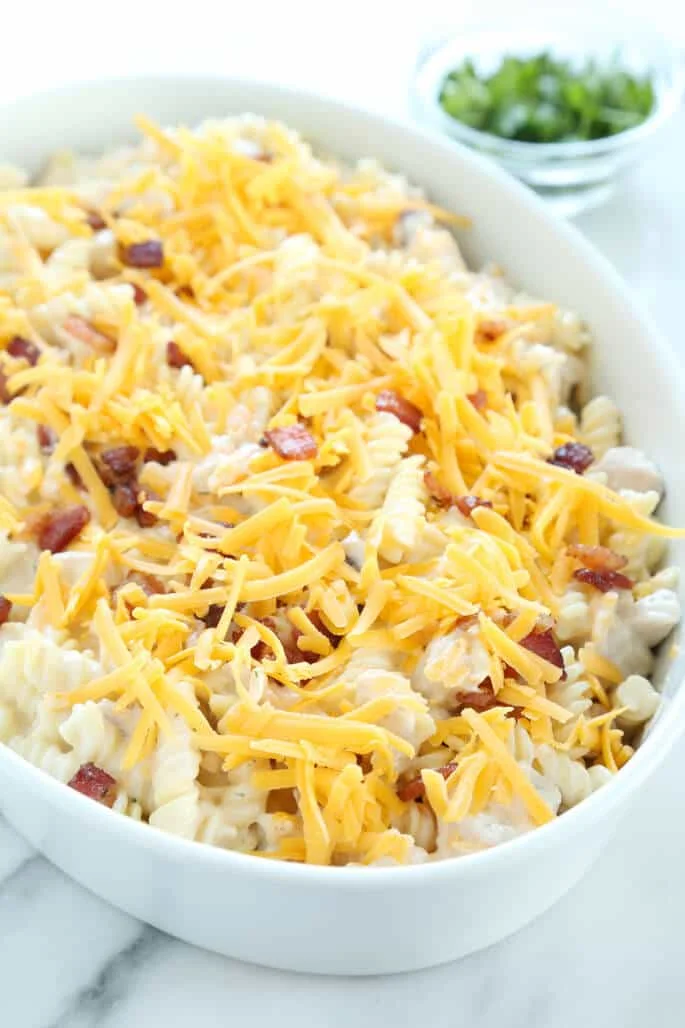 Chicken bacon casserole in white dish before being cooked