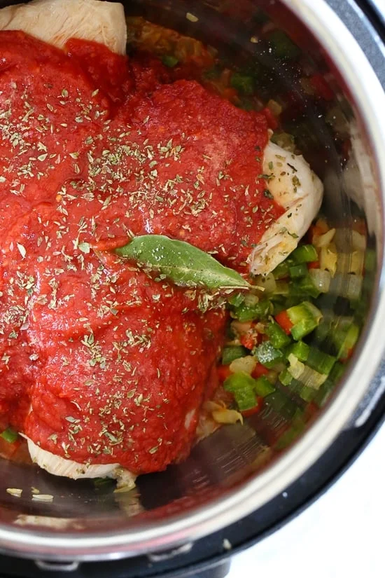 Chicken Cacciatore made in an Instant! The sauce is hearty and chunky, loaded with chicken, tomatoes, peppers and onions (I sometimes add mushrooms too!) 
