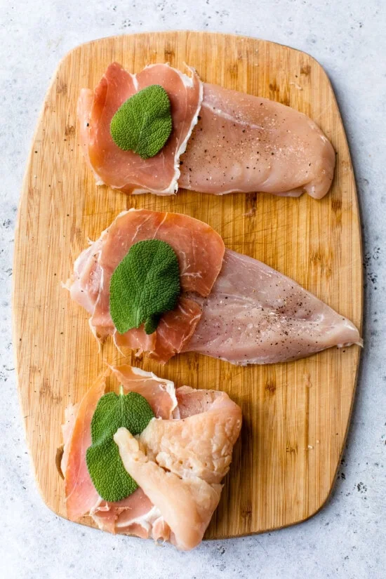 Chicken cutlets topped with proscuitto and sage