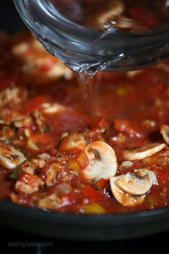 Chicken sausage, bell peppers, onions and mushrooms simmered in a marinara sauce then baked in the casserole with whole wheat macaroni topped with mozzarella.