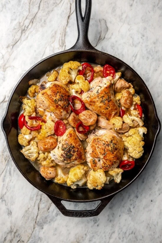 Chicken scarpariello in cast iron skillet.