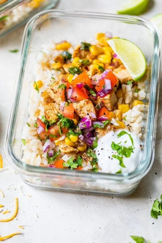 Chicken Taco Poblano Rice Bowls in a glass meal prep container.