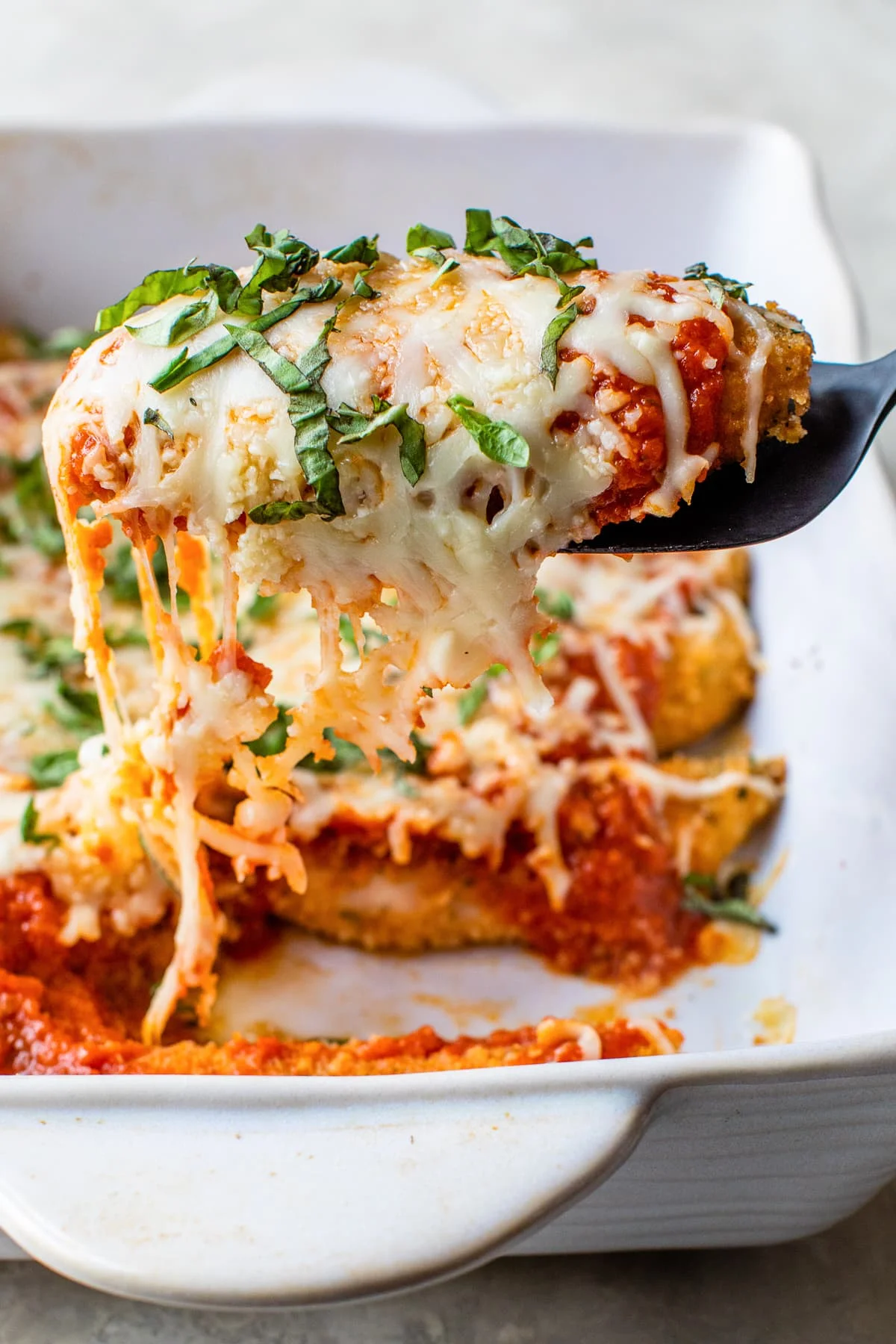 Chicken Tenders Parmesan on a spatula