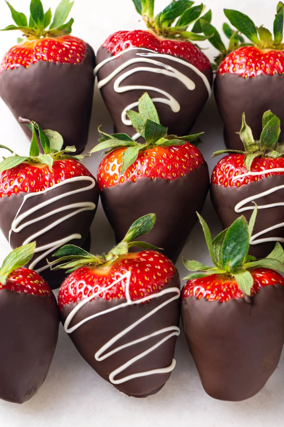Chocolate-covered strawberries in three rows of three