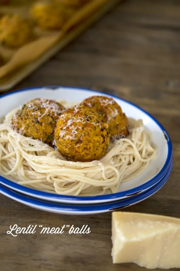 Close u of spaghetti and meatballs in white plate