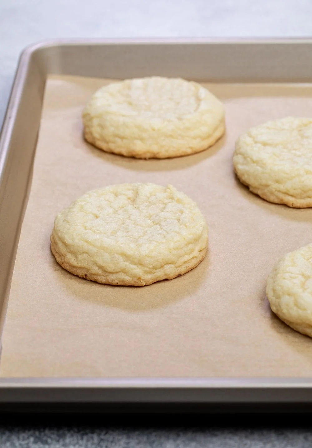 closeup image of baked light yellow pain gluten free Crumbl cookie